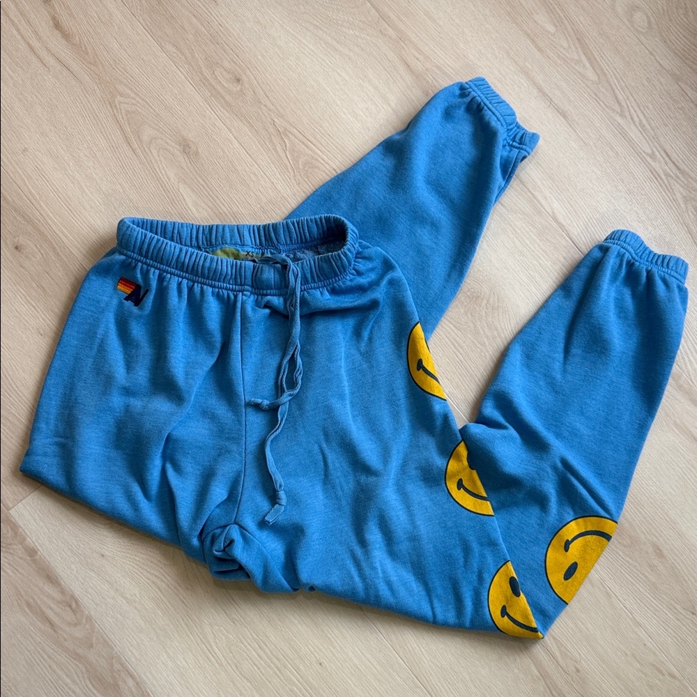 Aviator Nation Blue Joggers with Yellow Smiley Faces